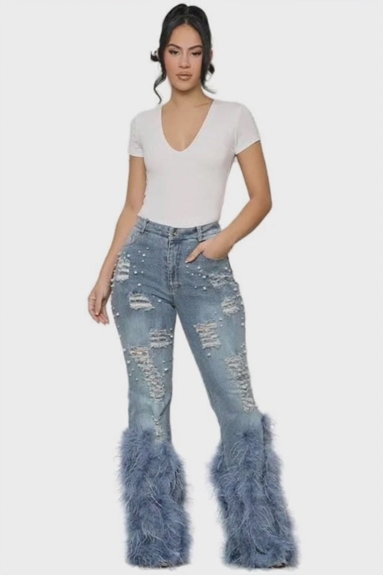 Model wearing Unique Kulture feather detail elastic waist denim jeans
 blue version walk thru