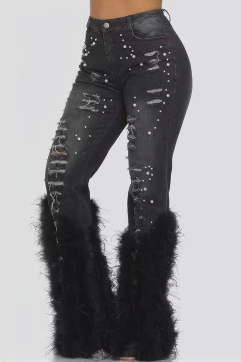 Model wearing Unique Kulture feather detail elastic waist denim jeans
 dancing in jeans