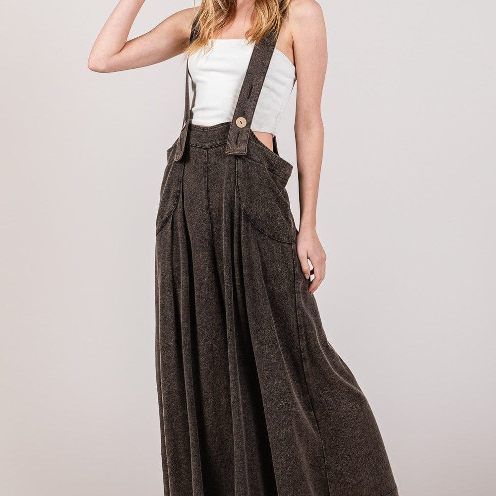  Unique Kulture Sage Designer Overalls. These overalls feature a stylish sage color and unique design details. With a relaxed fit and adjustable straps, they offer both comfort and fashion-forward style. Perfect for adding a trendy edge to any casual ensemble, these overalls are a standout piece from the Unique Kulture collection