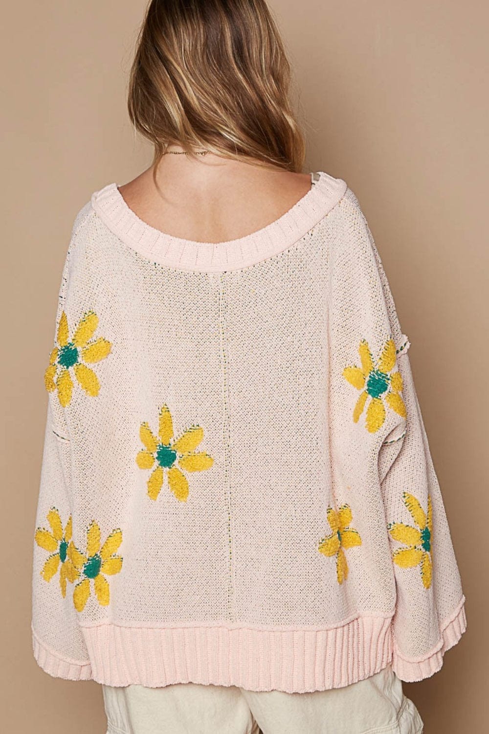 Back  view of the V-Neck Floral Pattern Chenille Sweater, featuring a stylish V-neckline, long sleeves, and a relaxed fit. The sweater is made from soft chenille fabric with a luxurious feel, showcasing a unique berber flower print and contrast stitching details, perfect for cozy and fashionable outfits.
