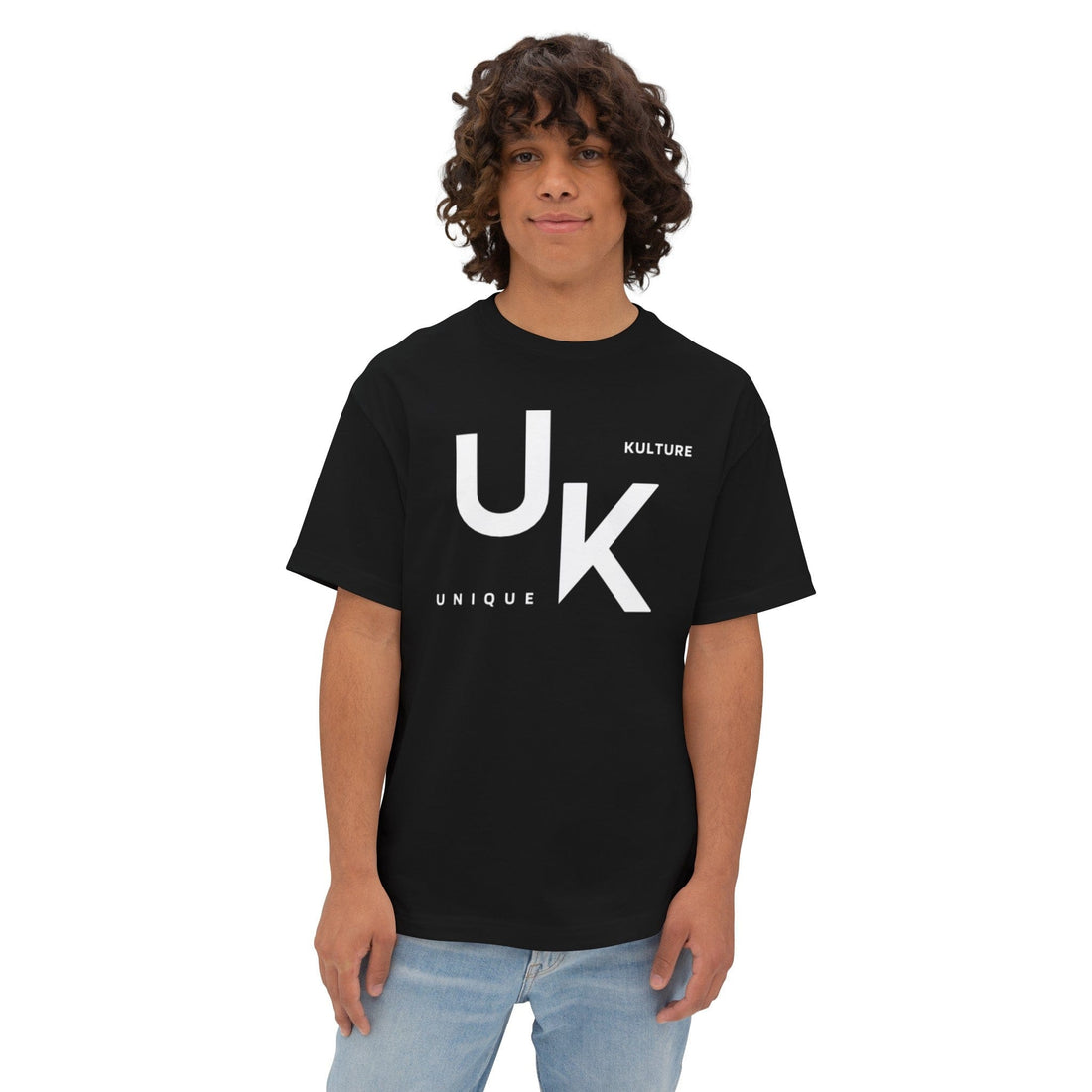 Unisex designer t-shirt by Unique Kulture. Model wearing relaxed fit boxy tee with dropped shoulders, showcasing the contemporary silhouette. Shirt made from 100% soft, airlume combed and ring-spun cotton fabric. Available in various colors.