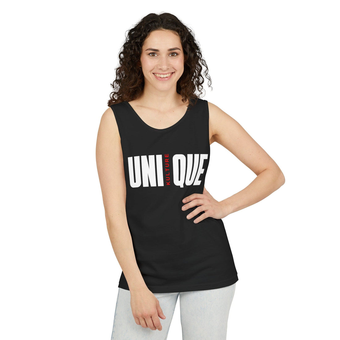 t: Unisex garment-dyed tank top by Unique Kulture. Relaxed fit on model, showcasing the drape of the 100% cotton fabric. Available in multiple vibrant, eco-friendly dyed colors. Sleeveless design with a classic scoop neckl