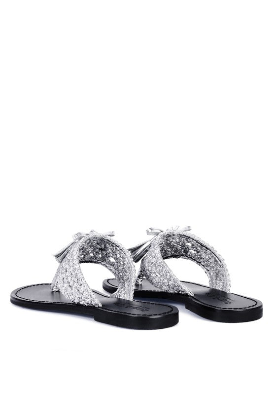 Handwoven natural suede thong flats with tassel accents

 silver
