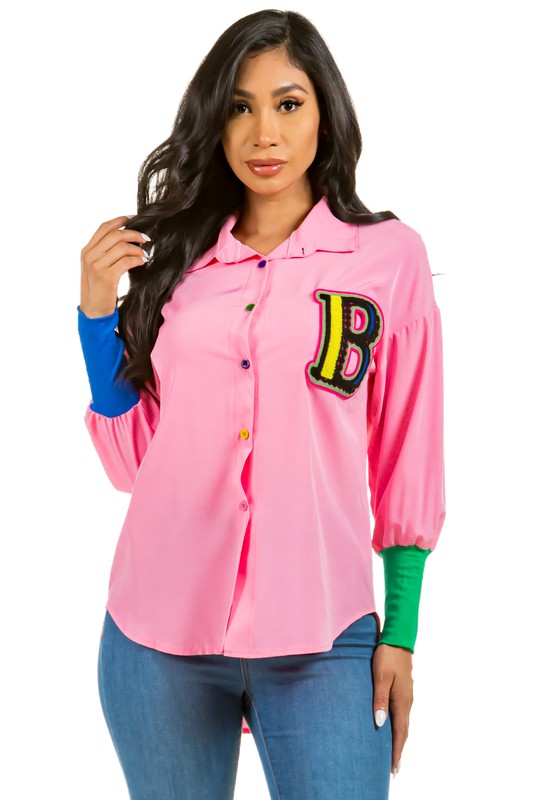 Model wearing Unique Kulture luxury sexy fashion top with long sleeves, color button, and high-low hem

 pink 