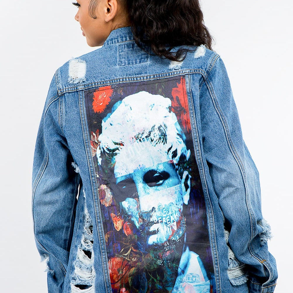 Front view of the Unique Kulture American Bazi Full Size Button Up Distressed Denim Jacket, featuring a stylish distressed design, classic button-up closure, and a relaxed fit. The jacket showcases a vintage look with washed detailing, perfect for layering over casual outfits