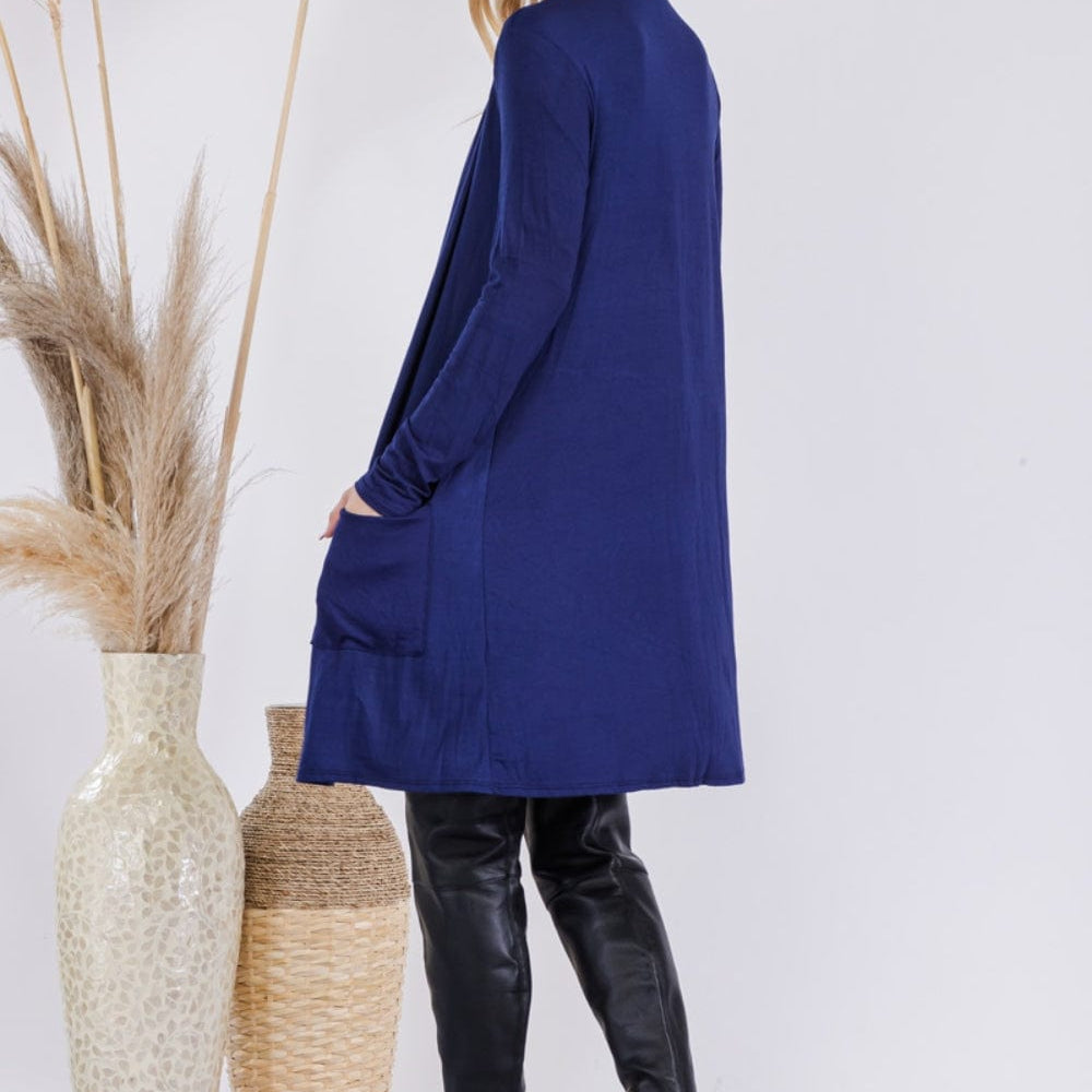  Celeste Full Size Open Front Cardigan with Pockets, featuring a stylish and versatile open-front design in a solid color. The cardigan is made from a highly stretchy fabric blend, showcasing its comfortable fit and functional pockets, perfect for layering over various outfits.
