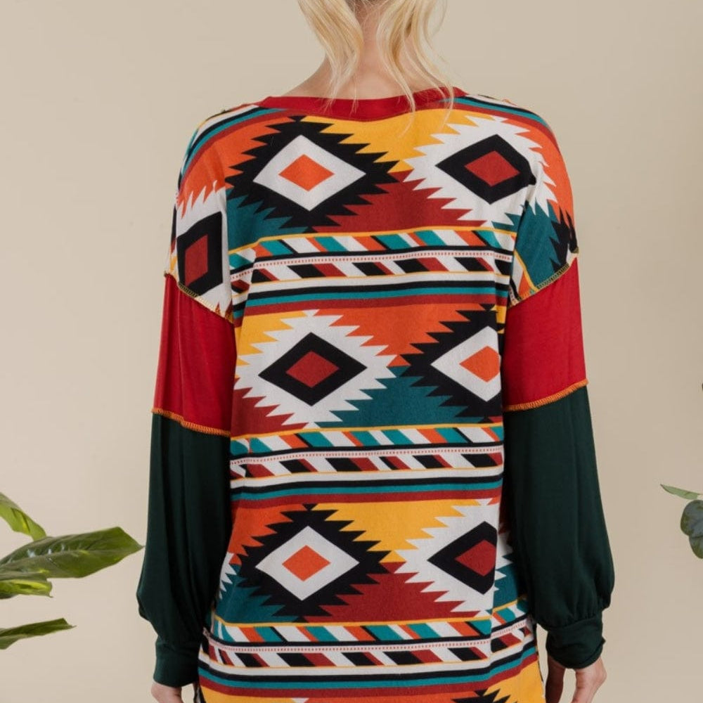 "back view of the Celeste Full Size Exposed Seam Print Color Block T-Shirt, showcasing its vibrant contrasting colors and modern exposed seam design. The t-shirt features a slightly stretchy fit and an opaque fabric, perfect for a stylish and comfortable casual look