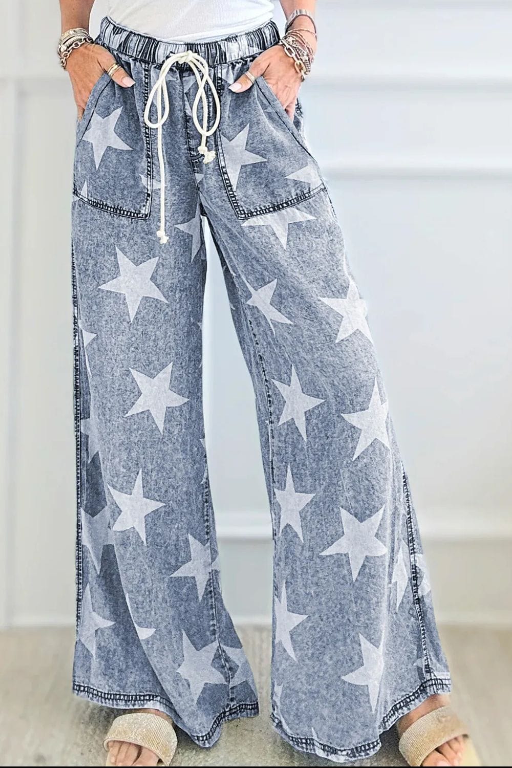 Drawstring Star Wide Leg Jeans: "Drawstring Star Wide Leg Jeans featuring a relaxed fit, star pattern design, and adjustable drawstring waist, displayed on a model or hanger against a neutral background.