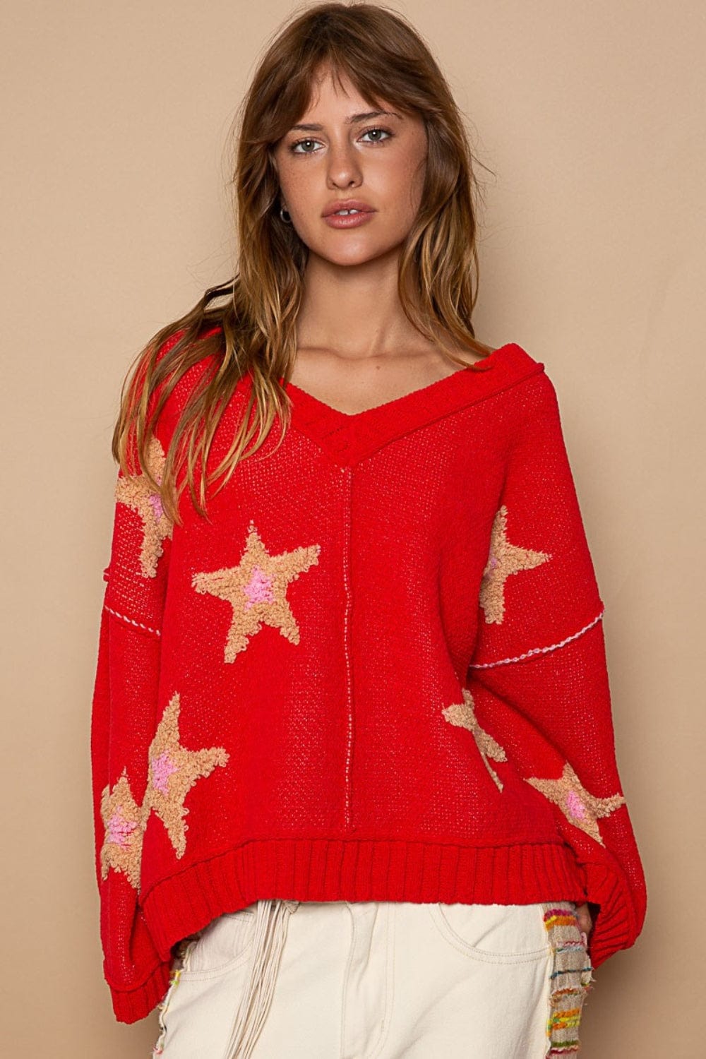 Front view of the V-Neck Long Sleeve Sweater, featuring a stylish V-neckline, long sleeves, and a regular fit. The sweater showcases unique design elements including contrast stitching, a color-blocked star berber patch, and outseam detailing, crafted from high-quality 100% polyester for a cozy and fashionable look.