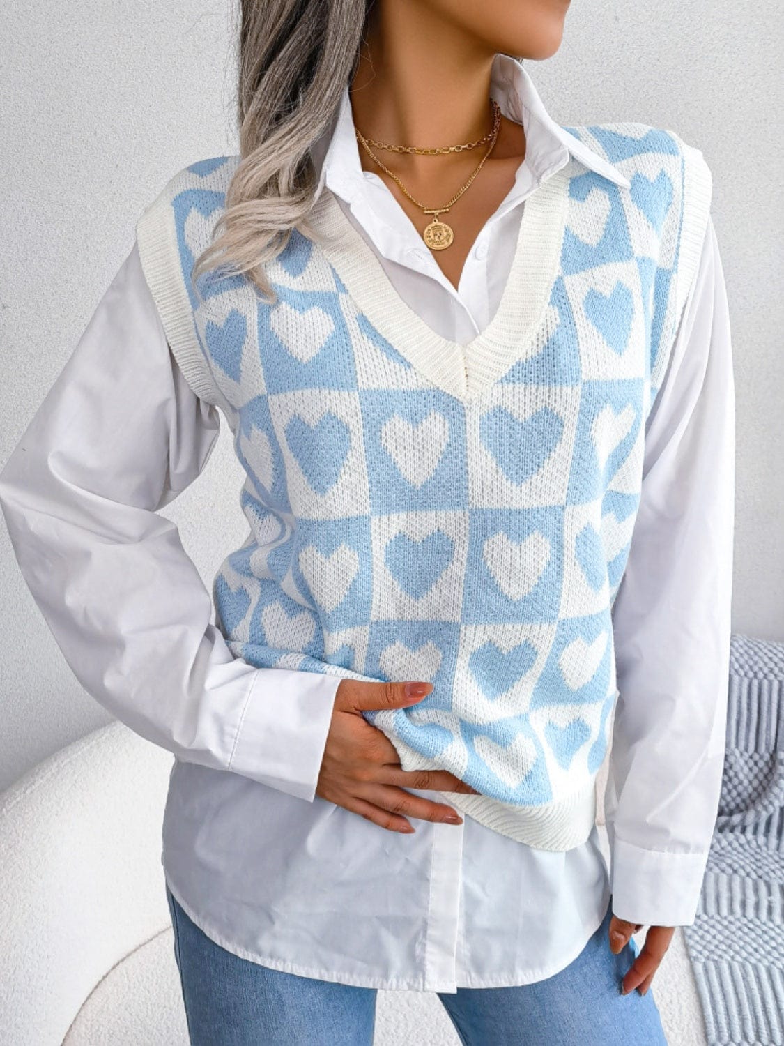 Heart V-Neck Sweater Vest featuring a charming heart pattern and a flattering v-neck design, perfect for stylish layering and casual outfits