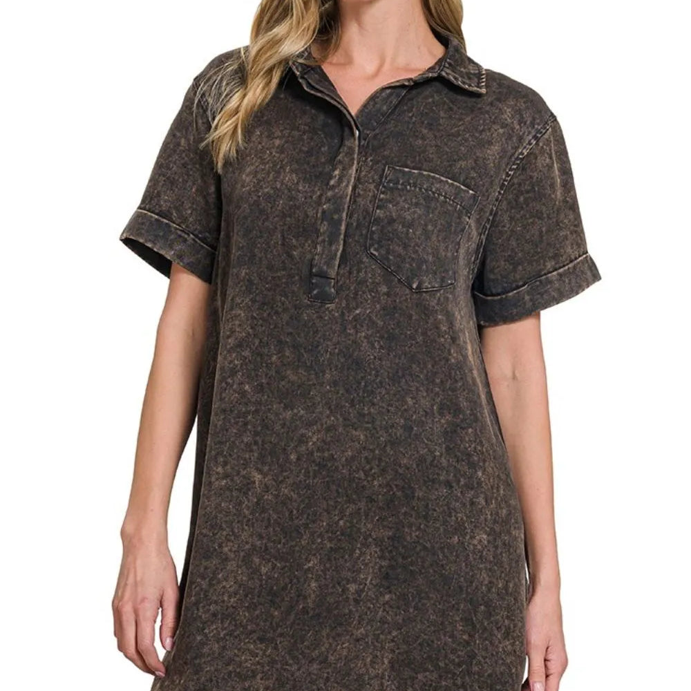 Model wearing a Tencel mineral washed collared shirt dress from Unique Kulture, featuring a relaxed fit, pockets, and a raw hem.


