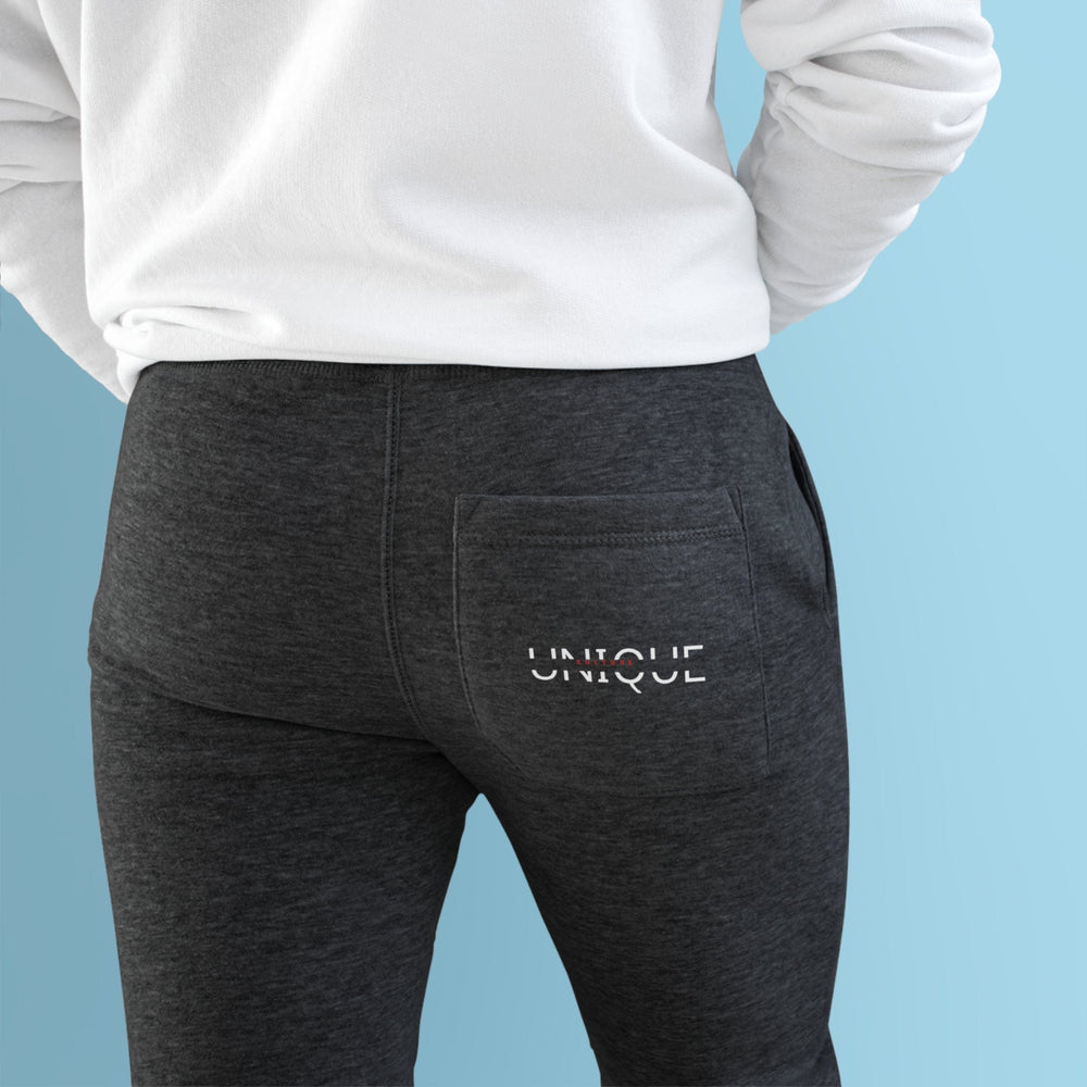 Unique Kulture Designer Fleece Joggers - Unisex, premium-quality joggers made from a soft blend of 80% combed ringspun cotton and 20% polyester in a medium-heavy fabric weight (8.25 oz/yd²). Features two spacious side pockets, a customizable back pocket, soft 3-end fleece construction, and ribbed bottom and waistband cuffs for a secure fit. Perfect for an active lifestyle or lounging, these stylish and comfortable joggers offer a customizable back pocket for personalization.