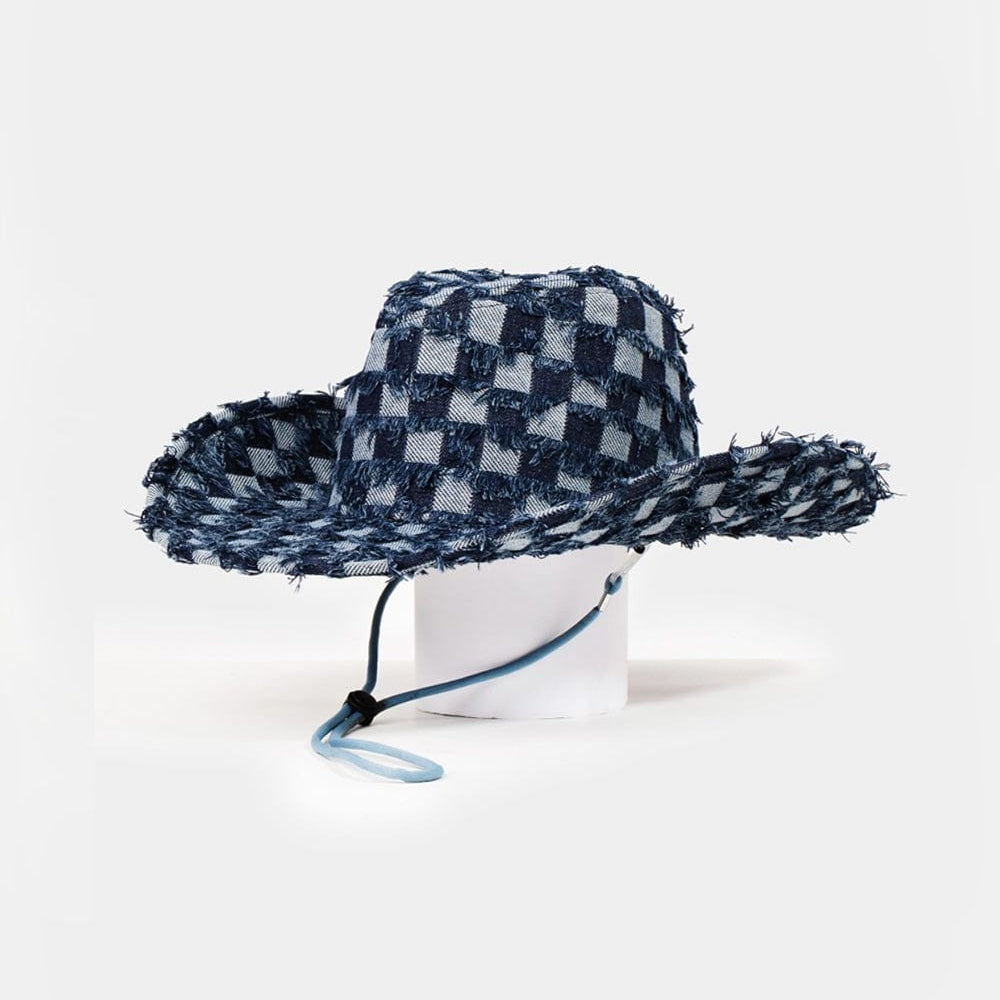 A denim cowboy hat with a checkered fringe, showcasing a unique twist on western fashion by Unique Klture Fame