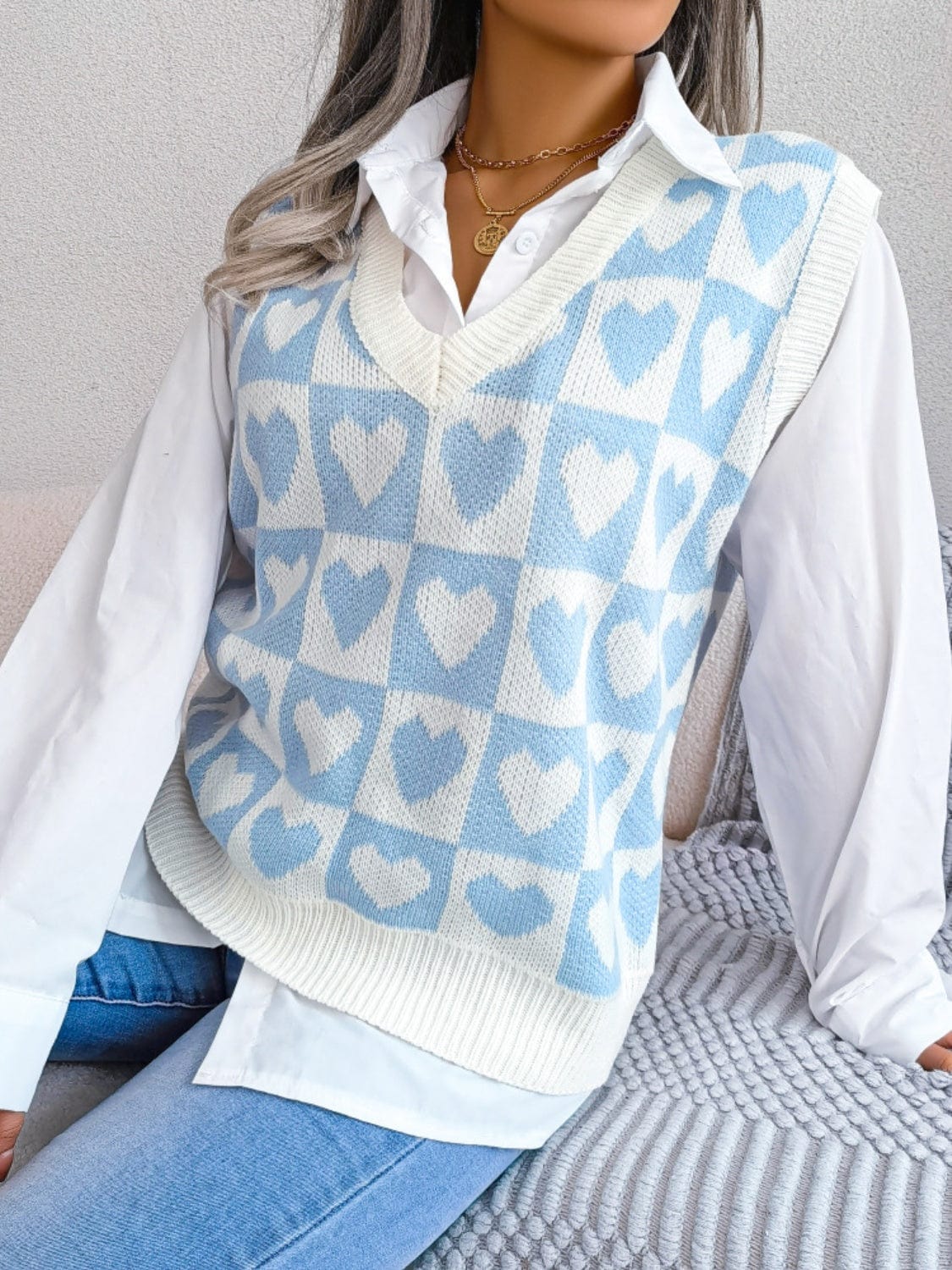 Heart V-Neck Sweater Vest featuring a charming heart pattern and a flattering v-neck design, perfect for stylish layering and casual outfits