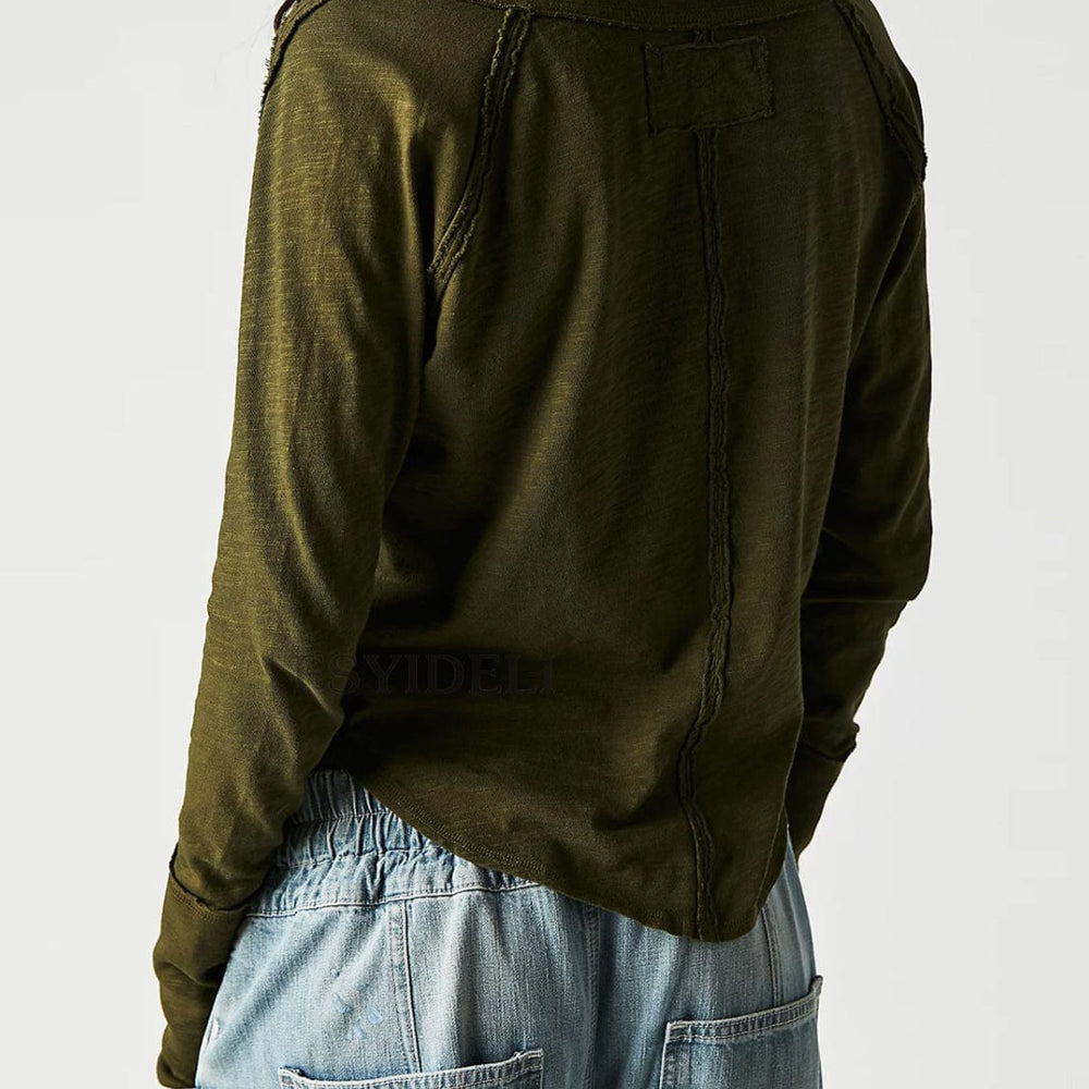 backview of the Unique Kulture Exposed Seam Notched Long Sleeve T-Shirt, showcasing its modern design with a notched neckline and exposed seam details. The shirt features a relaxed fit and is made from high-quality fabric, perfect for casual wear or making a fashion statement