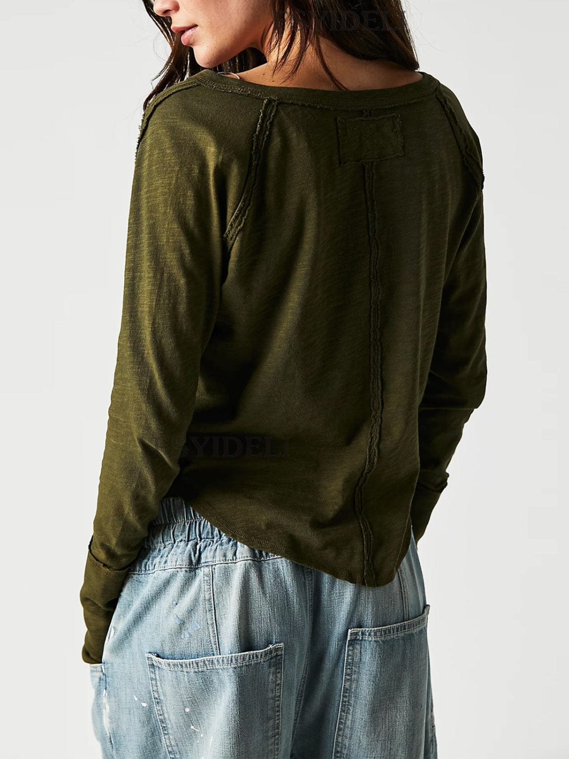 backview of the Unique Kulture Exposed Seam Notched Long Sleeve T-Shirt, showcasing its modern design with a notched neckline and exposed seam details. The shirt features a relaxed fit and is made from high-quality fabric, perfect for casual wear or making a fashion statement