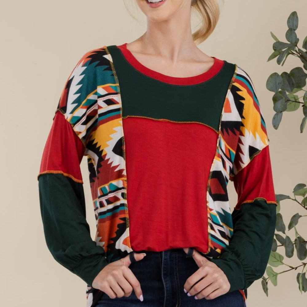 "Front view of the Celeste Full Size Exposed Seam Print Color Block T-Shirt, showcasing its vibrant contrasting colors and modern exposed seam design. The t-shirt features a slightly stretchy fit and an opaque fabric, perfect for a stylish and comfortable casual look
