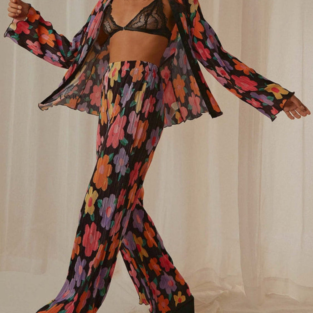 Front view of the Unique Kulture Printed Collared Neck Long Sleeve Top and Pants Lounge Set, featuring a stylish collared neck design and buttoned front. The set includes a long sleeve top and matching pants, showcasing a coordinated look in a comfortable and chic fabric