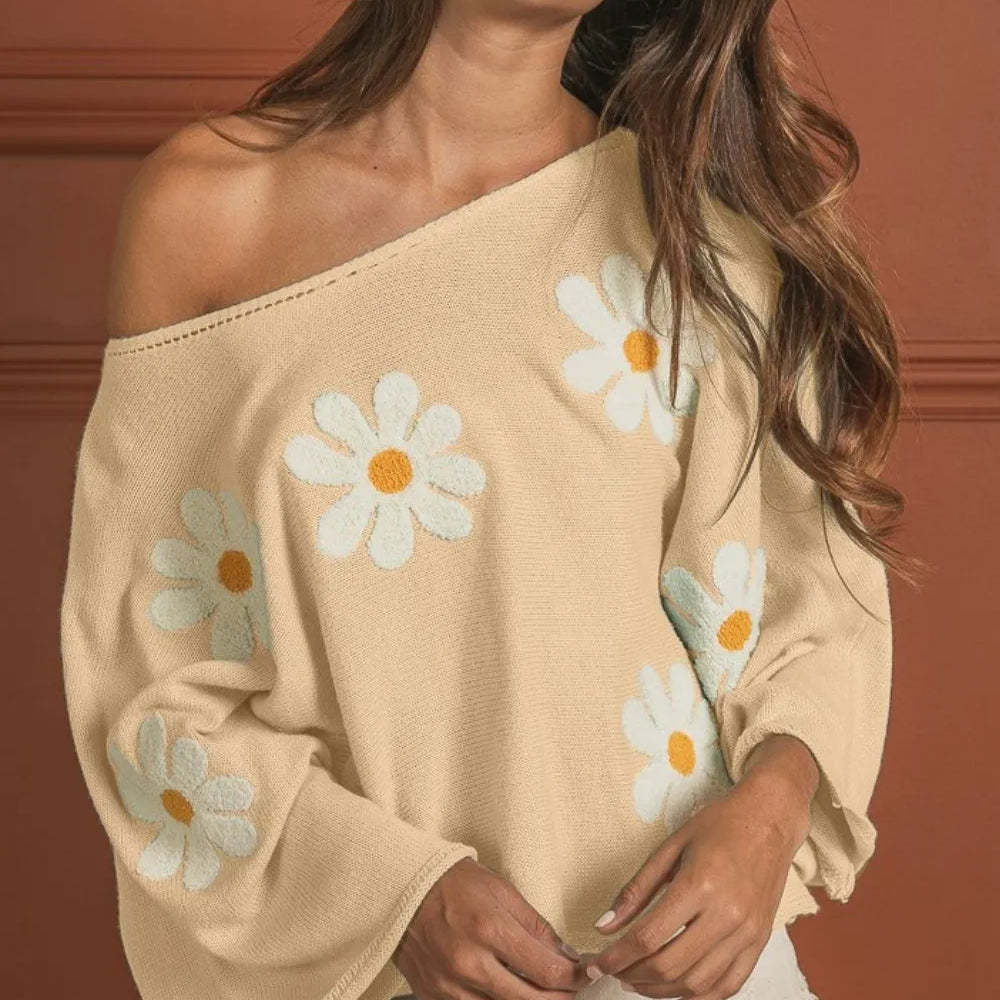 Woman wearing a BiBi Flower Embroidery Loose Fit Knit Top with delicate floral embroidery, relaxed fit, and soft knit fabric-perfect for boho spring and summer style.

