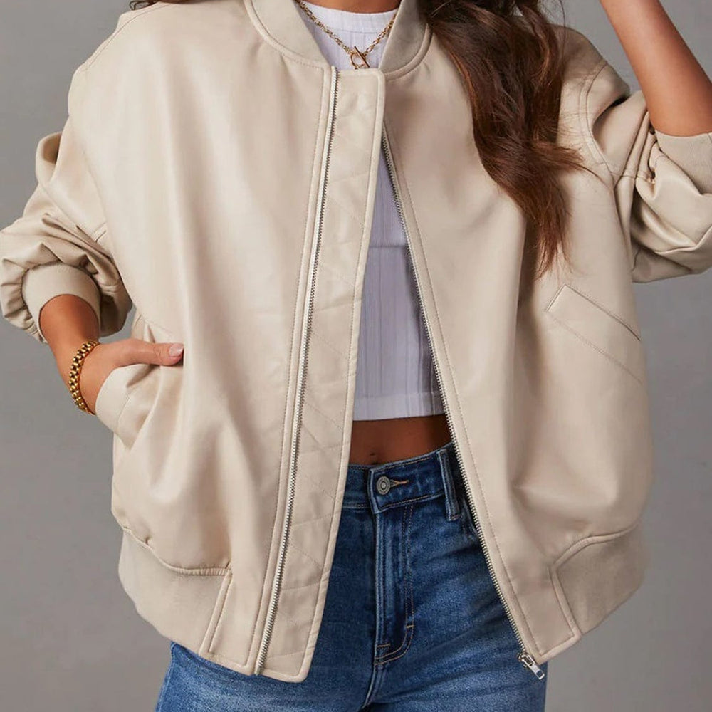  A stylish Unique Culture Zip Up Long Sleeve Jacket featuring a sleek zip-up design and functional pockets. The jacket is displayed against a neutral background, showcasing its modern silhouette and lightweight construction. Made from 100% PU, this versatile outerwear piece is perfect for layering and everyday wear, combining fashion with practicality.