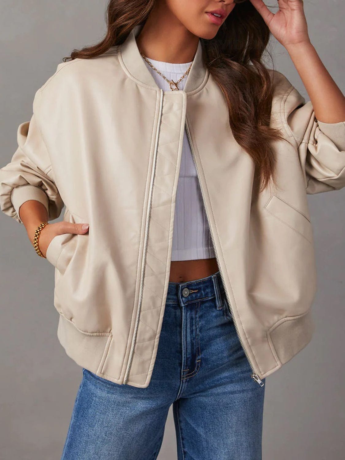  A stylish Unique Culture Zip Up Long Sleeve Jacket featuring a sleek zip-up design and functional pockets. The jacket is displayed against a neutral background, showcasing its modern silhouette and lightweight construction. Made from 100% PU, this versatile outerwear piece is perfect for layering and everyday wear, combining fashion with practicality.