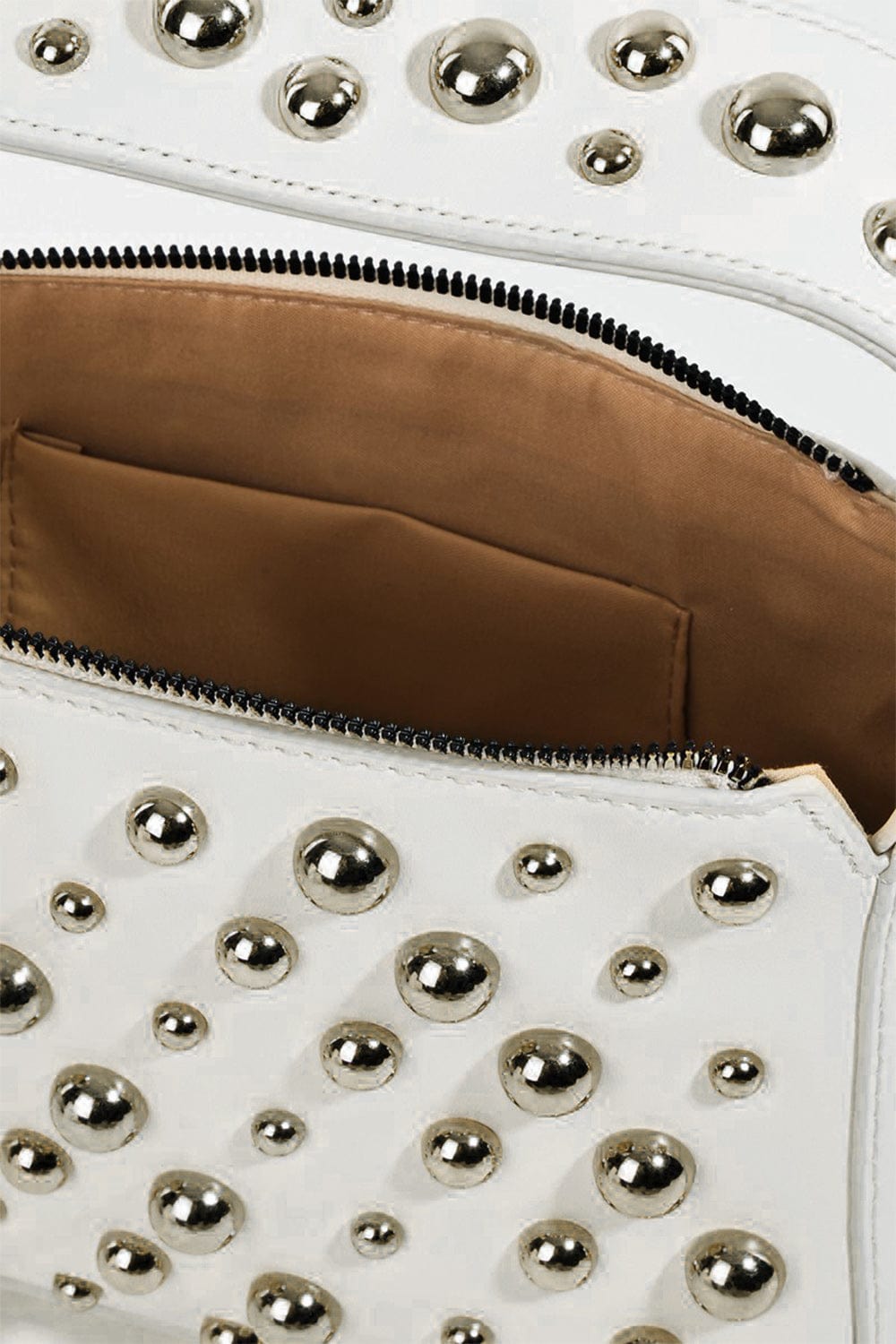 Unique Kulture Fame Ball Studded Square Handbag featuring a contemporary square silhouette adorned with eye-catching ball studs. The handbag is displayed in a stylish setting, highlighting its small size and elegant design, perfect for enhancing any outfit.