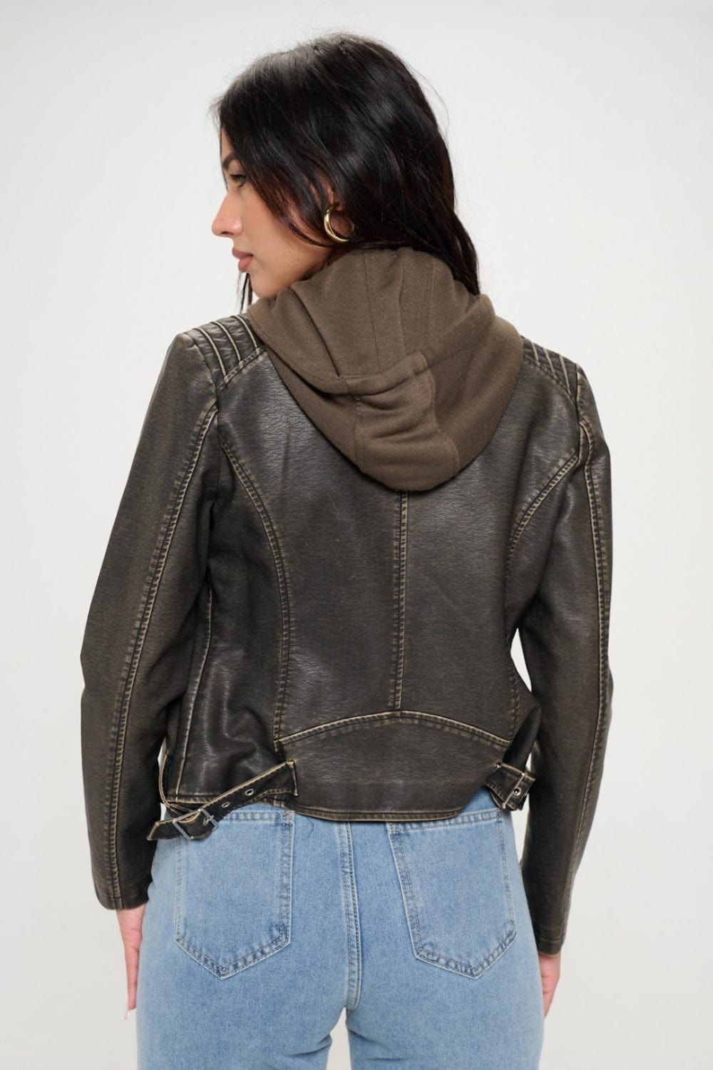 Front view of the Unique Kulture Coalition LA Zip Up Hooded Jacket, featuring a sleek design made from 100% vegan leather. The jacket includes a practical zip-up pocket and an adjustable hood, showcasing a stylish and sustainable option for fashionable
