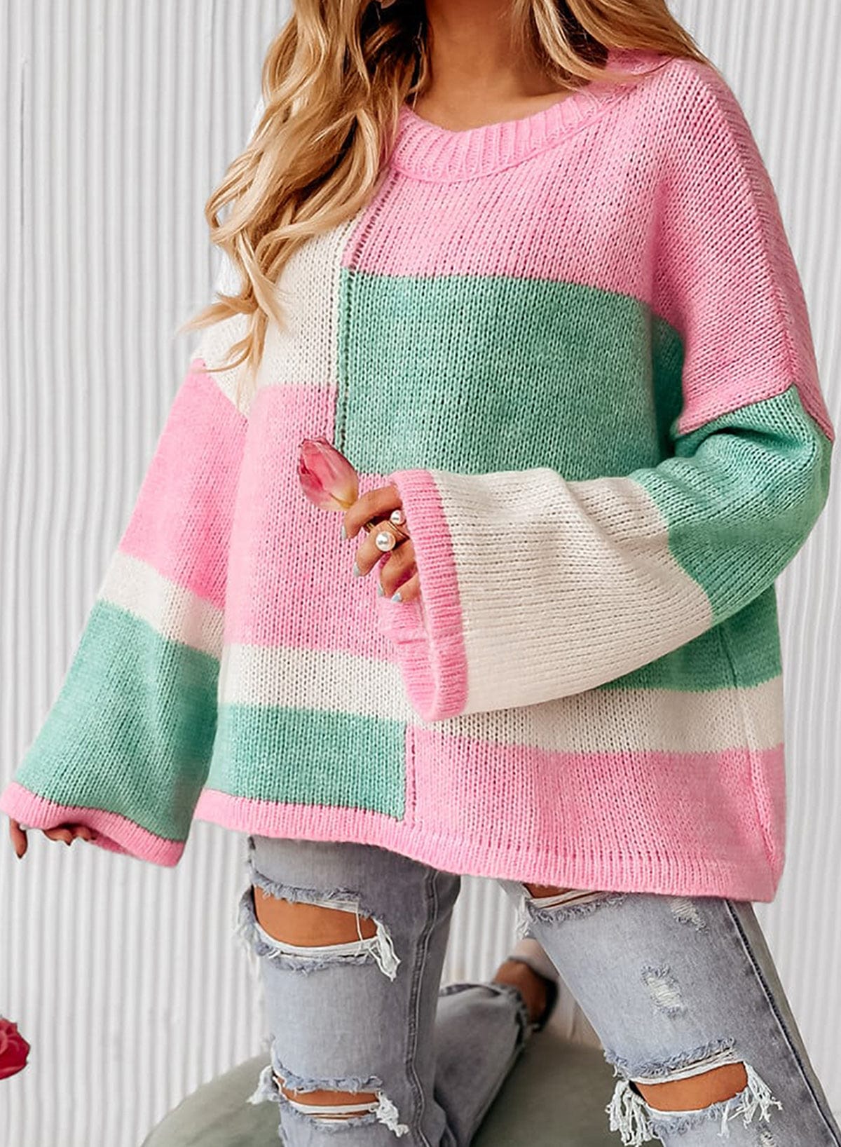 "Color Block Round Neck Drop Shoulder Sweater featuring a vibrant color block design, displayed on a mannequin against a neutral background, showcasing its relaxed fit and modern style."
