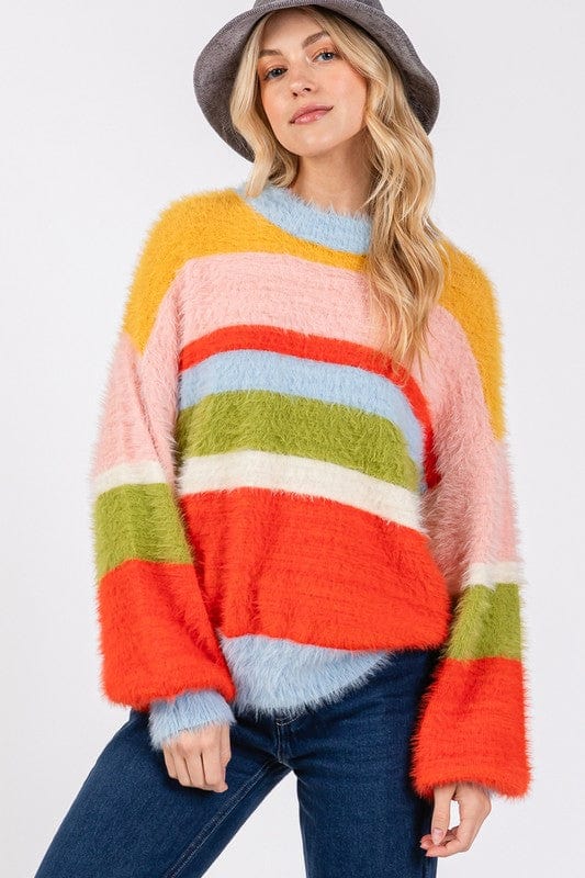 Color Block Round Neck Dropped Shoulder Sweater featuring a vibrant color block design, displayed on a mannequin against a neutral background, showcasing its relaxed fit and stylish appeal."
