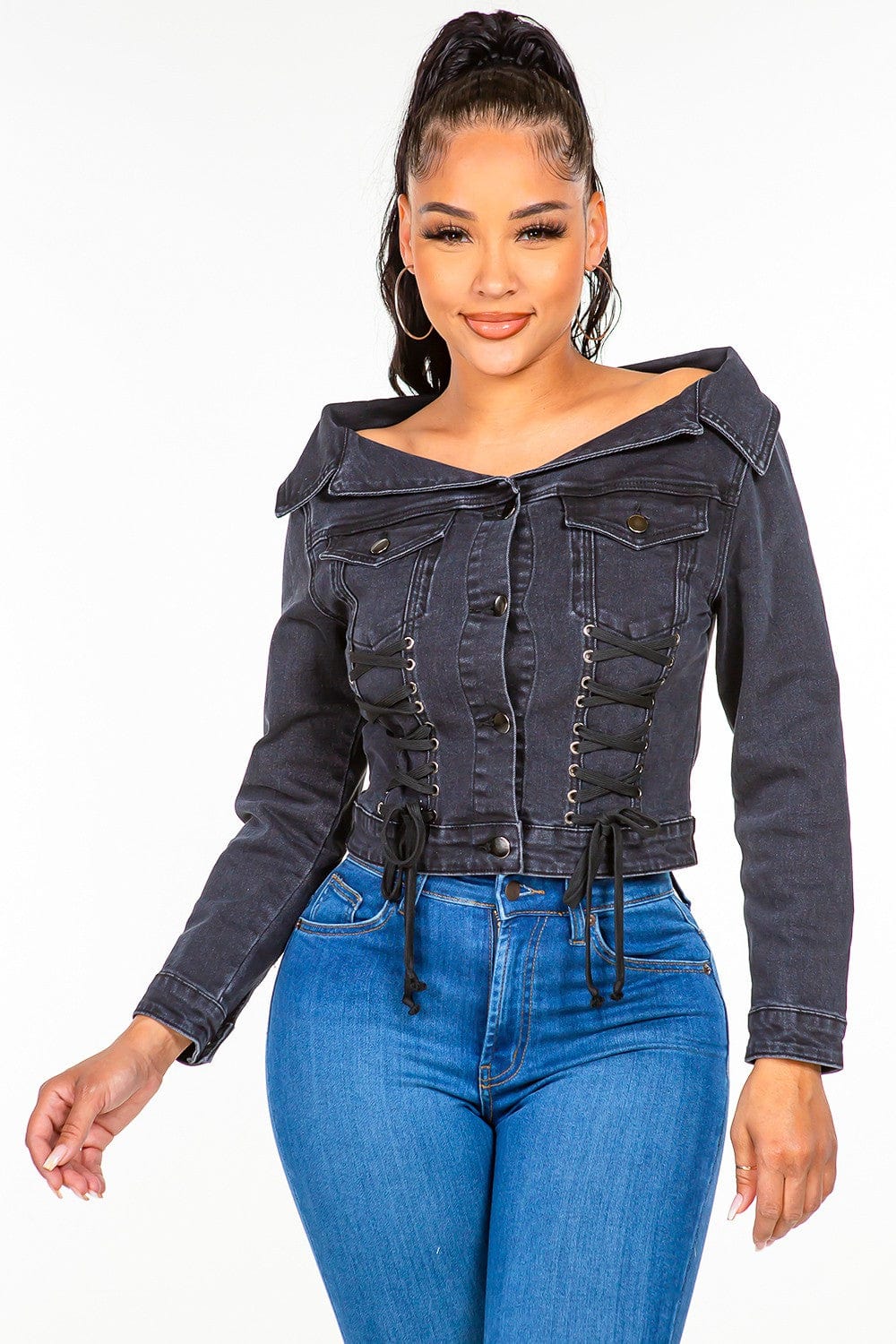 American Bazi Off Shoulder Lace Up Denim Jacket displayed on a model, featuring a stylish off-shoulder design, lace-up detailing, and a trendy cropped silhouette, set against a neutral background."
