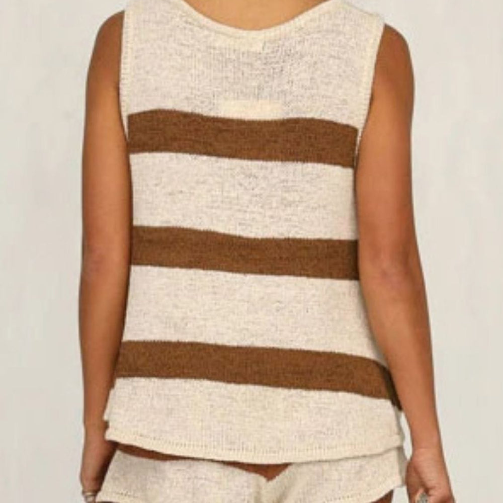 : A stylish two-piece sweater set featuring a V-neck sleeveless top in a soft fabric paired with drawstring shorts. The outfit is displayed on a neutral background, showcasing its comfortable and casual design, perfect for summer wear. The top highlights a flattering neckline, while the shorts feature an adjustable drawstring for a customizable fi