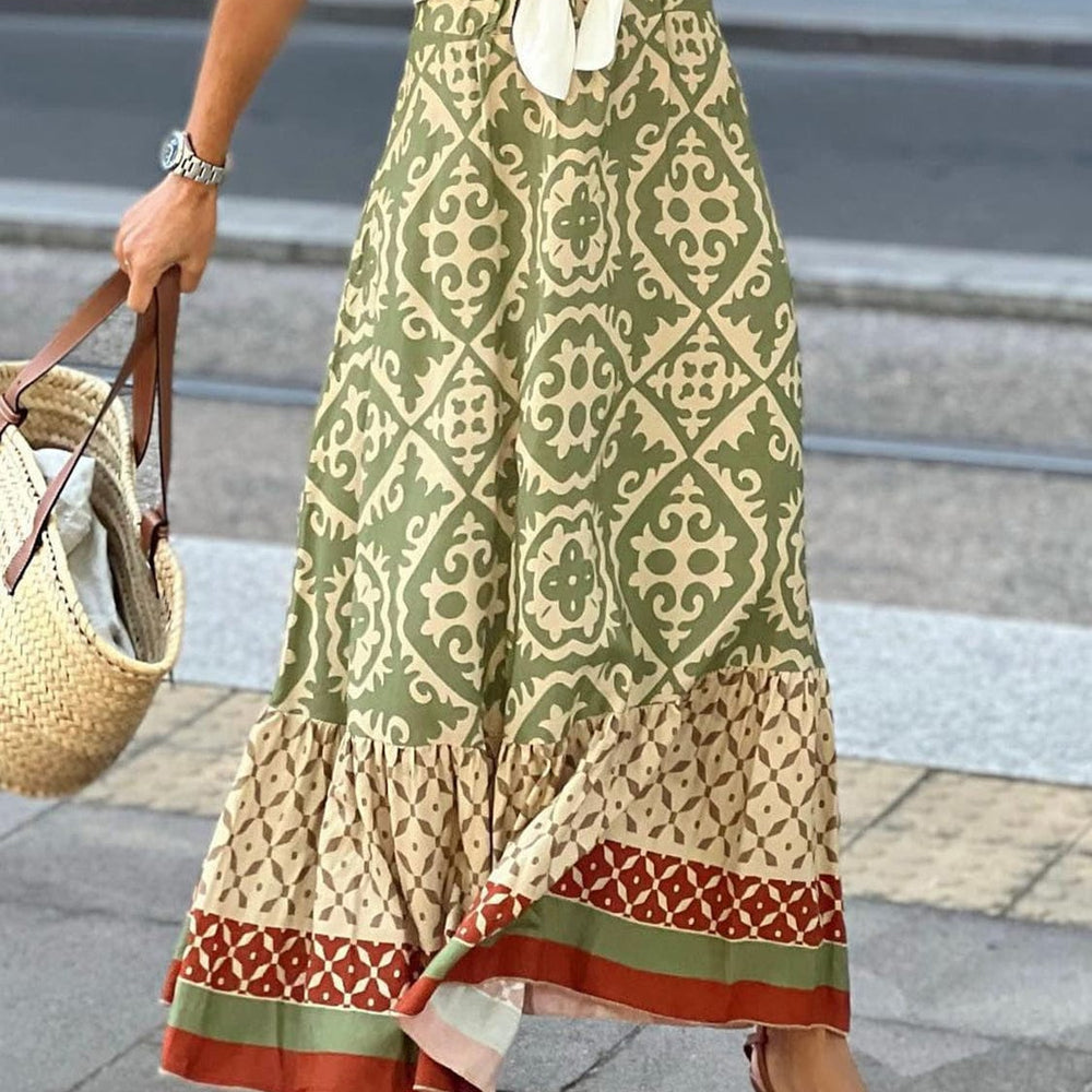 Black and white geometric print maxi skirt with elastic waistband. Long flowy skirt with bold triangle and diamond patterns in a modern abstract design. High-waisted floor-length skirt in a stretchy knit fabric