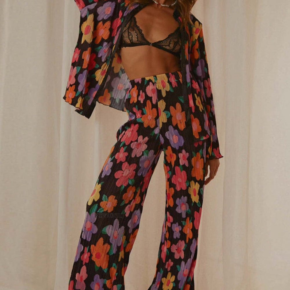 Front view of the Unique Kulture Printed Collared Neck Long Sleeve Top and Pants Lounge Set, featuring a stylish collared neck design and buttoned front. The set includes a long sleeve top and matching pants, showcasing a coordinated look in a comfortable and chic fabric
