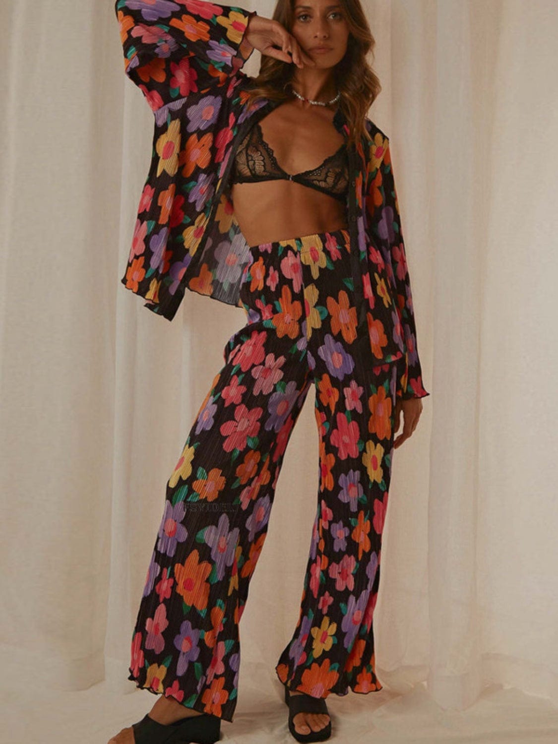 Front view of the Unique Kulture Printed Collared Neck Long Sleeve Top and Pants Lounge Set, featuring a stylish collared neck design and buttoned front. The set includes a long sleeve top and matching pants, showcasing a coordinated look in a comfortable and chic fabric
