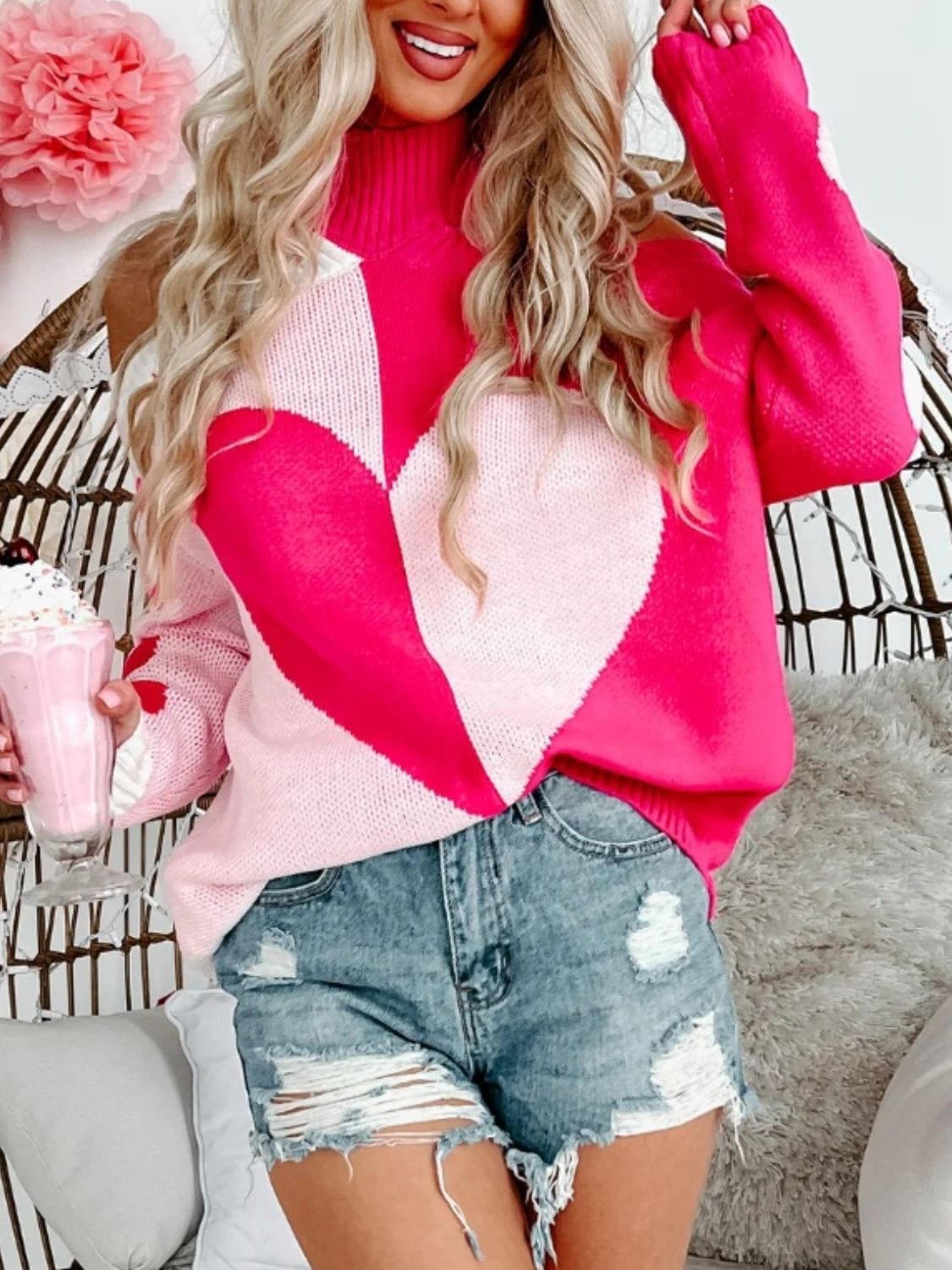 "Valentine's Day Heart Turtleneck Cold Shoulder Sweater featuring a stylish cold shoulder design, cozy turtleneck, and a playful heart pattern, displayed on a mannequin against a soft background."
Related
