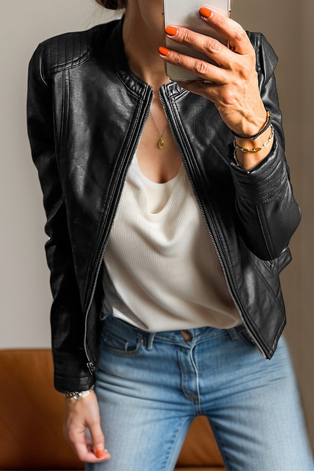 Front view of the Unique Kulture PU Leather Round Neck Long Sleeve Jacket, featuring a sleek design made from 100% PU leather. The jacket includes a round neckline, long sleeves, and practical pockets, with a lined interior for added comfort and warmth