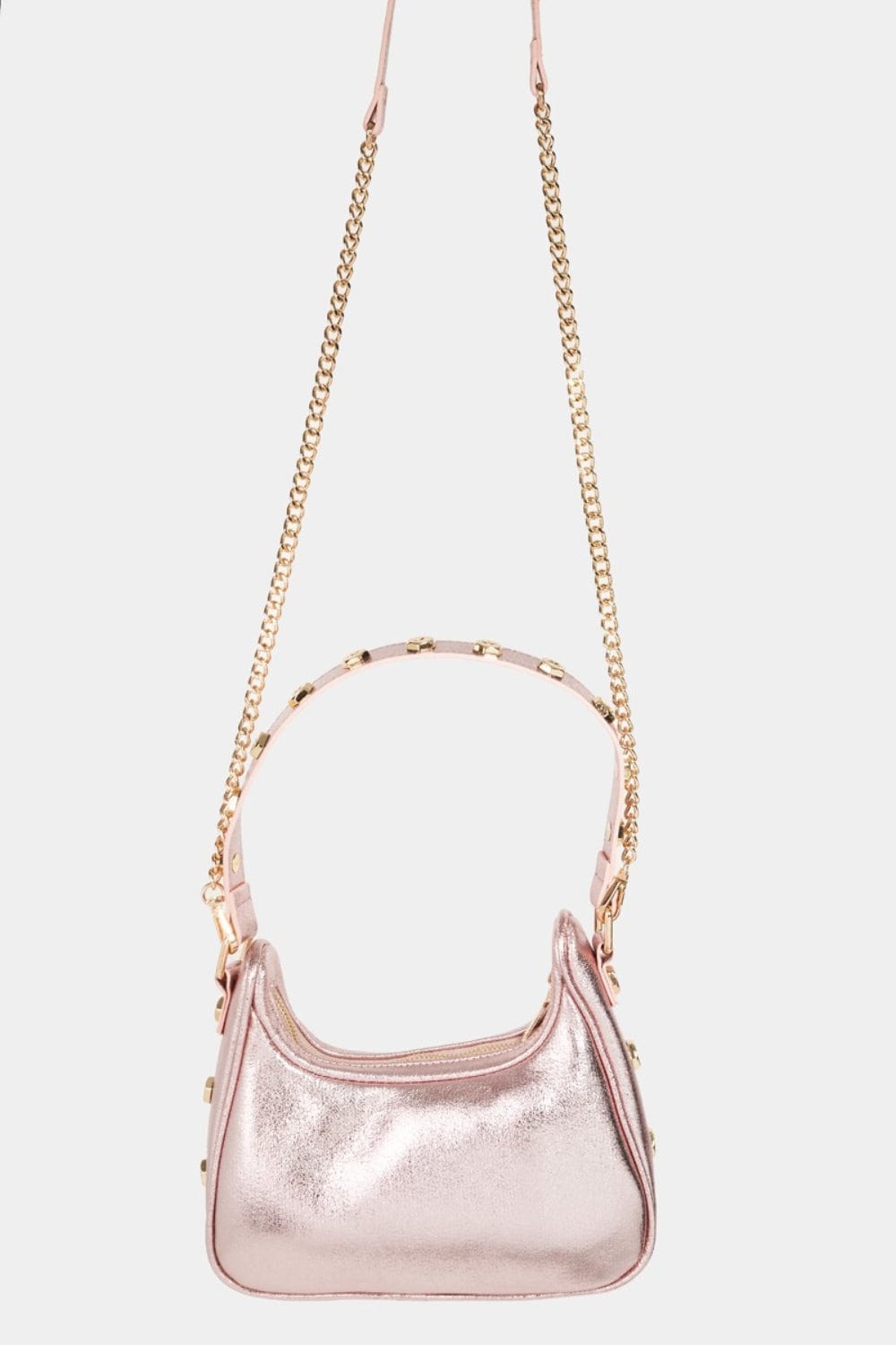 Fame Star Button Trim Hobo Handbag featuring a unique star button trim design and a relaxed hobo shape. The handbag is displayed in a stylish setting, showcasing its compact size and fashionable appeal, perfect for both casual and dressy occasions