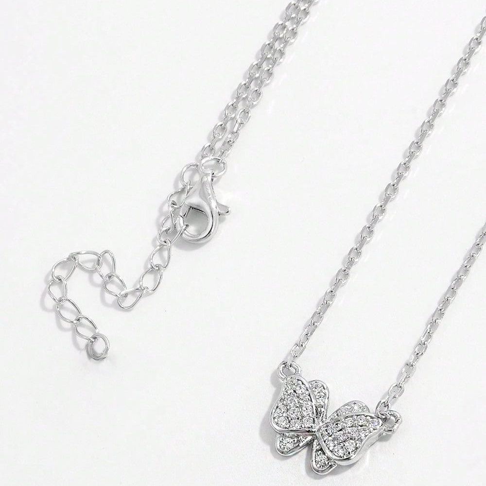 925 Sterling Silver Zircon Butterfly Pendant Necklace. The pendant is crafted in the shape of a butterfly and adorned with sparkling zircon gemstones. The necklace chain complements the pendant, showcasing its delicate beauty. This accessory exudes elegance and charm, perfect for adding a touch of sophistication to any outfit.