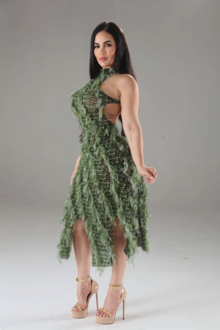 video photoshoot at unique kultureModel wearing Unique Kulture blue halter ruffled dress with open back and multi-ruffles green version close up 
