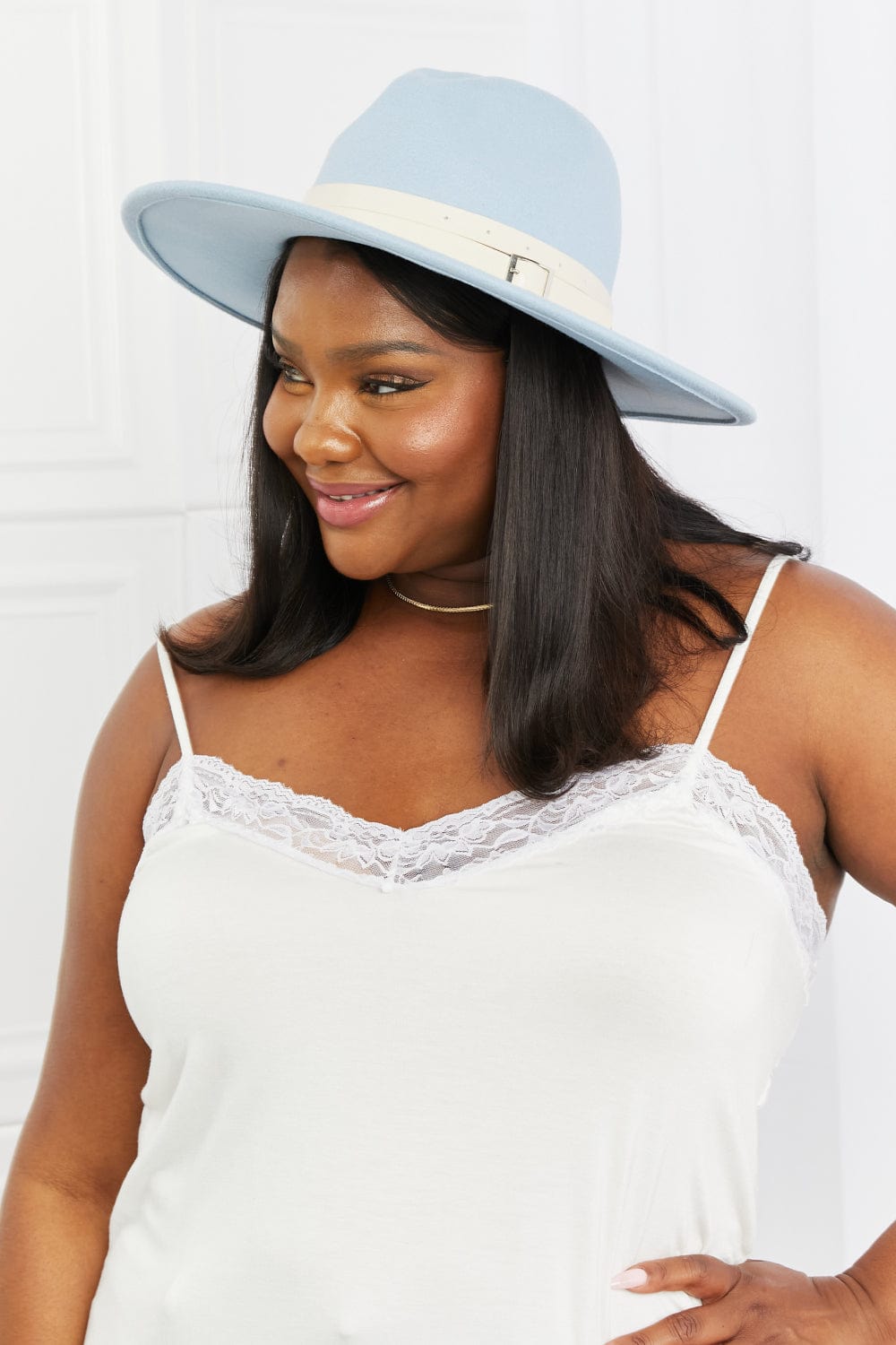 "Image of a stylish and unique Kulture designer 'Fame Summer Blues Fedora Hat.' This Fedora Hat features a sleek and contemporary design, with a vibrant blue hue that captures the essence of summertime fashion. The hat is adorned with intricate details, including a distinctive brim and a fashionable band. It exudes a sense of elegance and individuality, making it a standout accessory for any fashion-forward individual."
