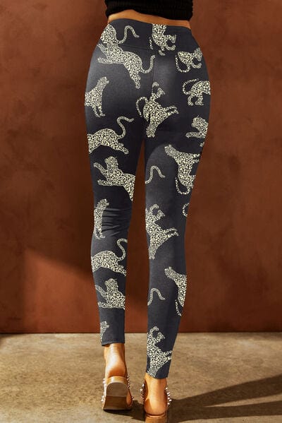 "Alt text: A pair of Unique Kulture designer leggings featuring a distinctive animal print design with a distressed finish. These high-waisted leggings are a fashionable and eye-catching addition to any wardrobe, offering a bold and stylish statement for activewear or casual outfits."