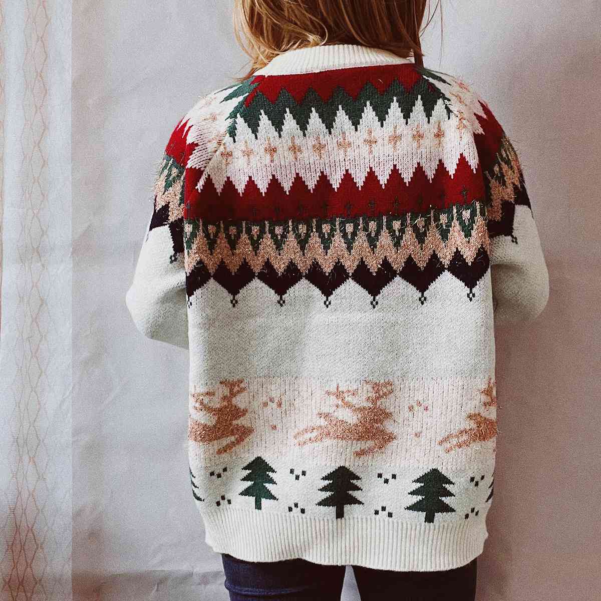 A close-up image of a Unique Kulture Christmas Element Long Sleeve Sweater, featuring festive holiday patterns and vibrant colors, perfect for celebrating the holiday season in style."