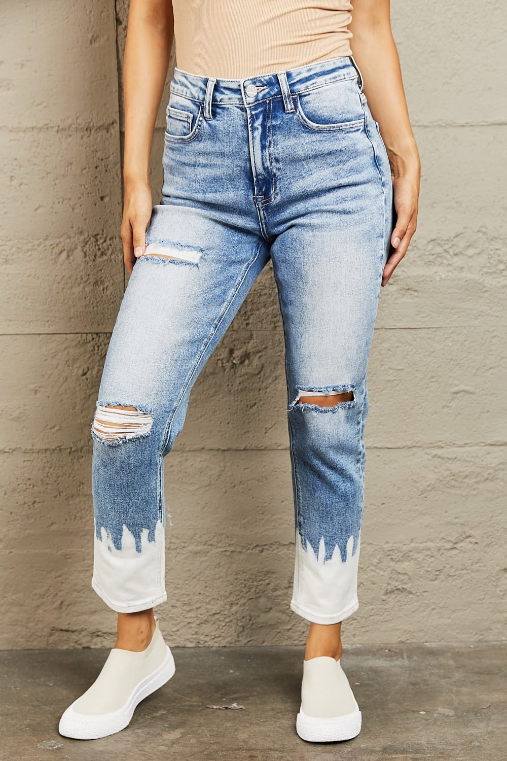 Unique Kulture BAYEAS High Waisted Distressed Painted Cropped Skinny Jeans - Fashion-forward medium wash jeans with high waist design for a flattering fit. Edgy distressed detailing and unique white paint bottom detail. Perfect blend of comfort and style. Shop now on Unique Kulture.