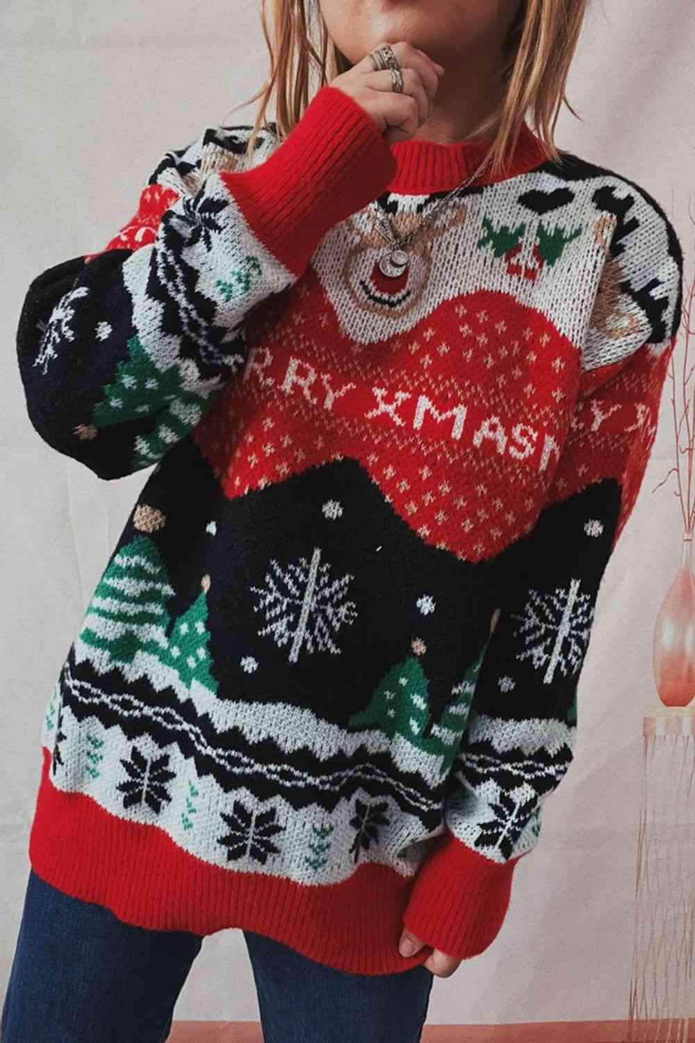 "Image of a Unique Kulture Christmas Element Long Sleeve Sweater in festive red and green colors. The sweater features intricate patterns of snowflakes, reindeer, and Christmas trees, creating a cheerful and holiday-themed design. Perfect attire for celebrating the festive season in style."