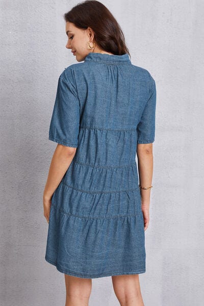 Unique Kulture Button Up Collared Neck Tiered Denim Dress: A stylish denim dress with a button-up front, featuring a collared neck and tiered design. The dress combines fashion and comfort, making it a versatile and trendy wardrobe choice