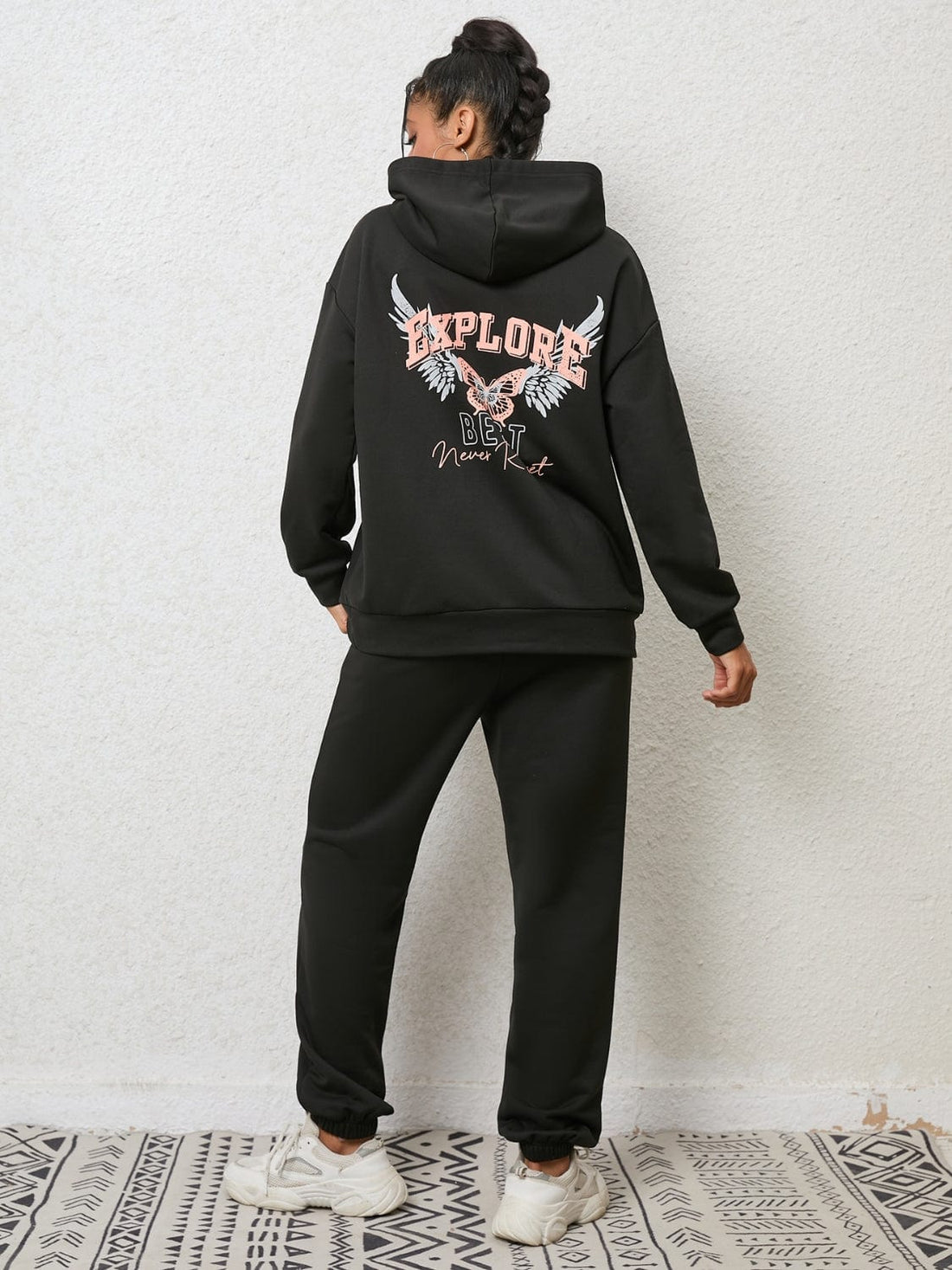 "An image featuring a stylish Unique Kulture Graphic Hoodie and Sweatpants Set. The hoodie is adorned with a vibrant and intricate graphic design, while the matching sweatpants complete the ensemble. The set exudes a trendy and urban fashion vibe, perfect for casual and comfortable wear."