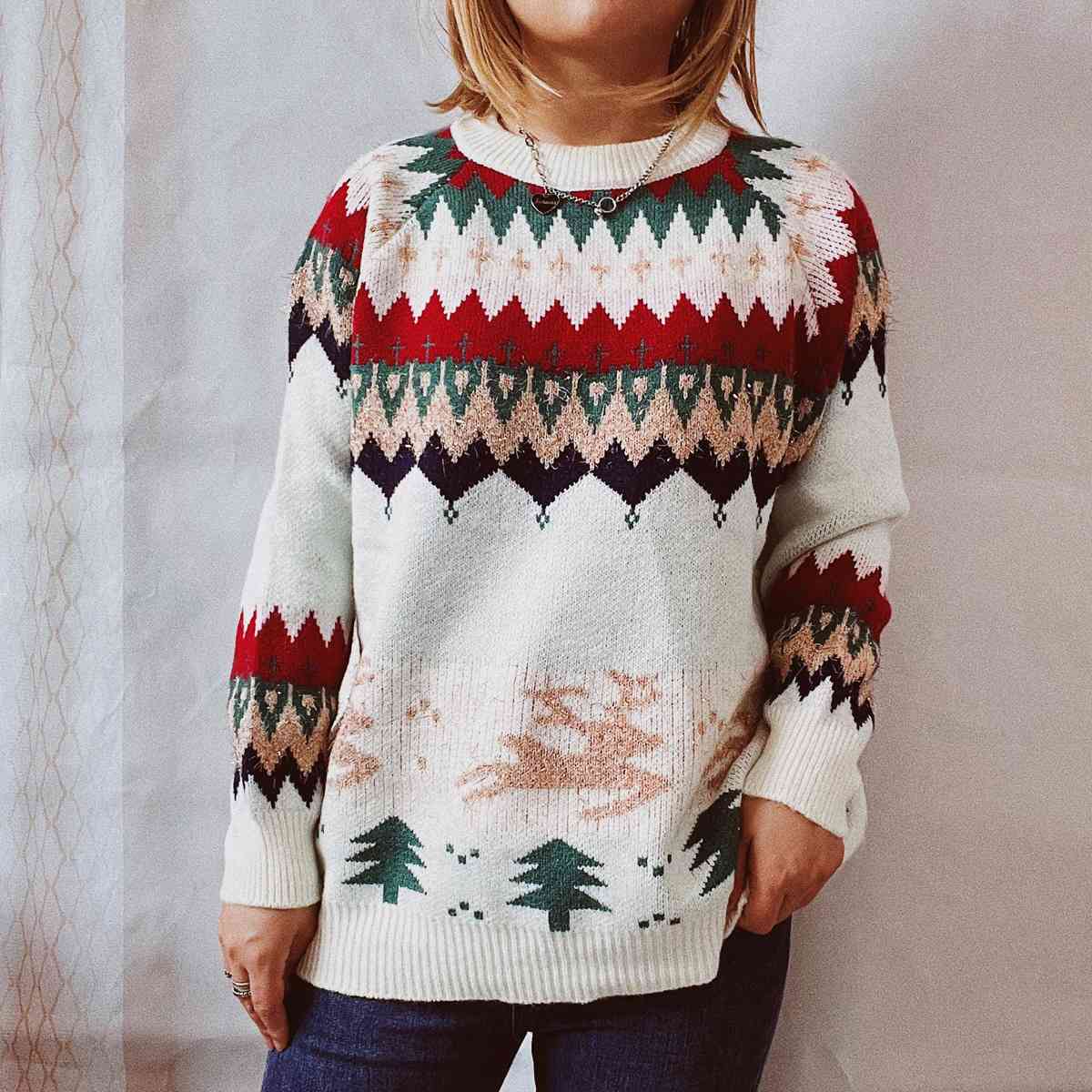 A close-up image of a Unique Kulture Christmas Element Long Sleeve Sweater, featuring festive holiday patterns and vibrant colors, perfect for celebrating the holiday season in style."