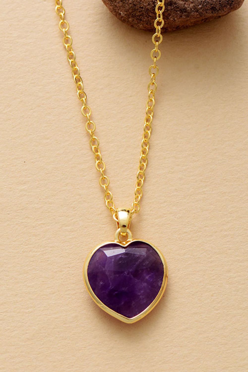 "Elevate Your Style and Heartfelt Connection with the Unique Kulture Natural Stone Heart Pendant Necklace. Meticulously crafted, this necklace showcases a stunning natural stone heart pendant that embodies both elegance and emotional significance. The carefully selected beads gracefully accentuate the pendant, resulting in a perfect fusion of style and sentiment. Embrace a distinctive look while symbolizing your deep-rooted emotions with this exquisite heart pendant necklace from Unique Kulture."