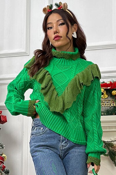 "Image: A cozy cable-knit sweater featuring a stylish ruffled mock neck and lantern sleeves. The intricate cable pattern adds texture to the sweater, creating a warm and fashionable look for cooler seasons."