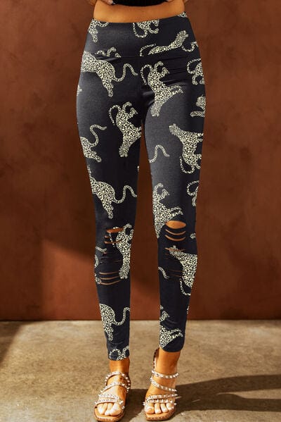 "Alt text: A pair of Unique Kulture designer leggings featuring a distinctive animal print design with a distressed finish. These high-waisted leggings are a fashionable and eye-catching addition to any wardrobe, offering a bold and stylish statement for activewear or casual outfits."